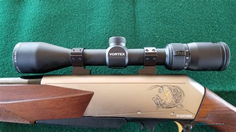 A magnifying glass. . Scope mounts for browning bar mk3